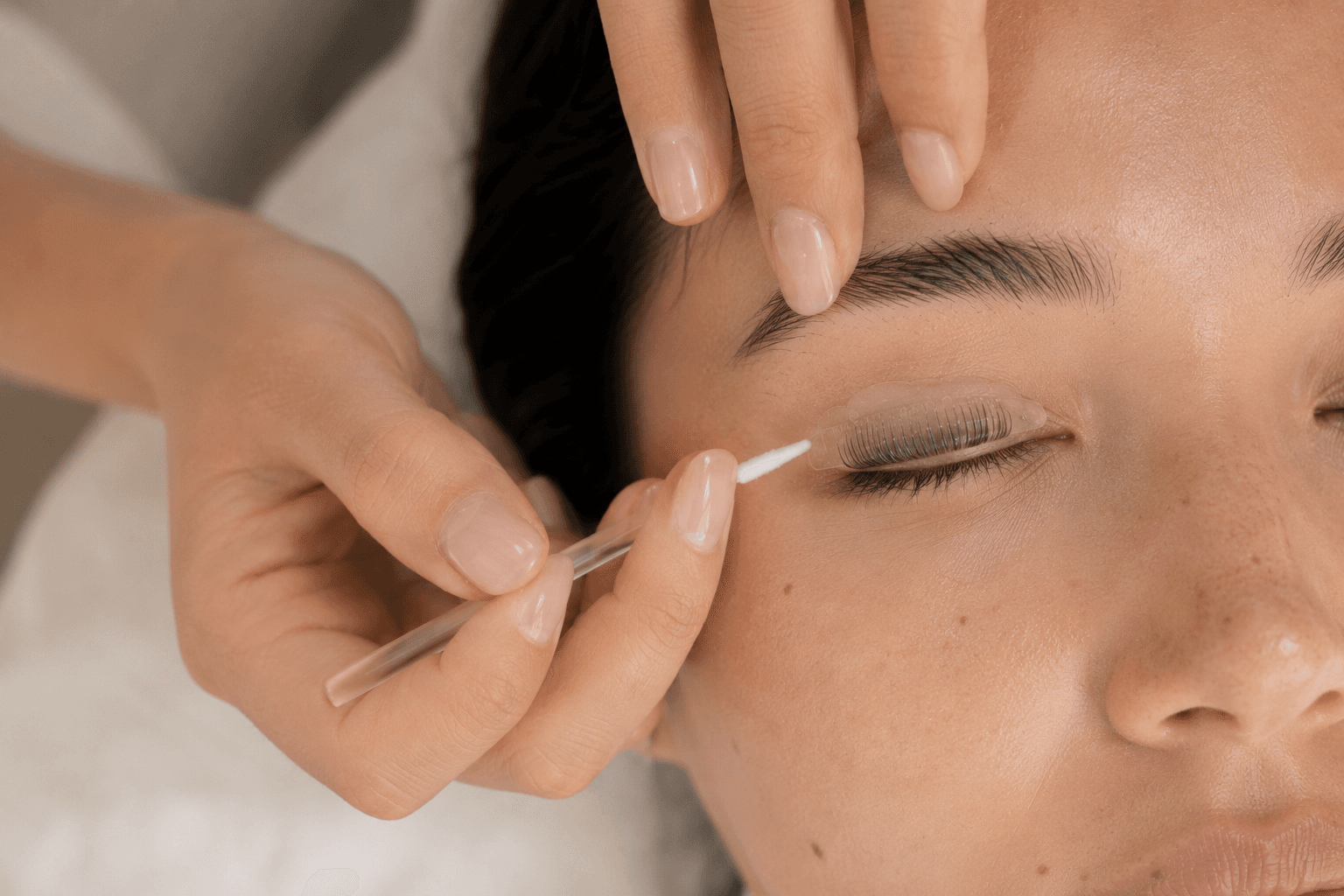 Close detail of a Korean lash lift treatment in progress
